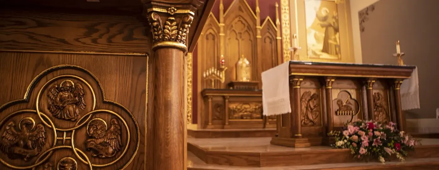 A carved wooden altar in a church sanctuary